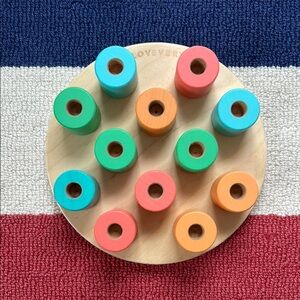 Lovevery wooden stacking pegboard